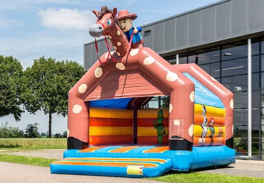 Super springkussen overdekt kopen in cowboy thema voor kinderen. Koop springkussen online bij JB Inflatables Nederland