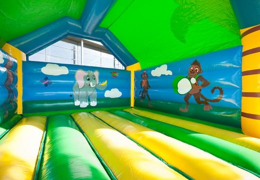 Groot springkasteel overdekt kopen met vrolijke animaties in jungle thema voor kinderen. Koop springkastelen online bij JB Inflatables Nederland