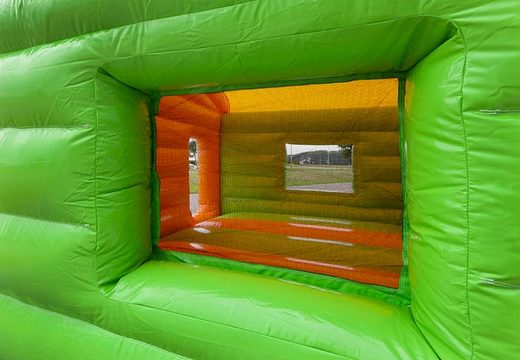 Overdekt maxi multifun springkasteel in jungle thema met een glijbaan bestellen voor kinderen. Koop springkastelen online bij JB Inflatables Nederland