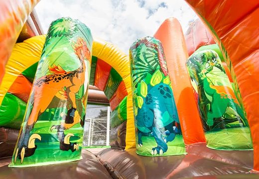 Springkussen in thema dinoworld met een glijbaan kopen voor kinderen. Bestel opblaasbare springkussens online bij JB Inflatables Nederland