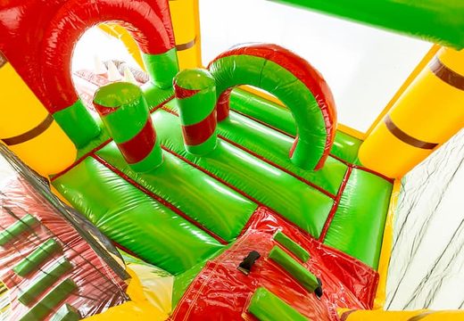 Koop medium opblaasbare jungle springkasteel met glijbaan voor kinderen. Bestel opblaasbare springkastelen online at JB Inflatables Nederland 